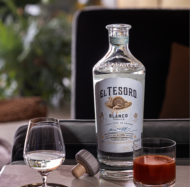 Sangrita drink recipe served in a rocks glass next to a snifter glass with El Tesoro's Blanco Tequila served neat.