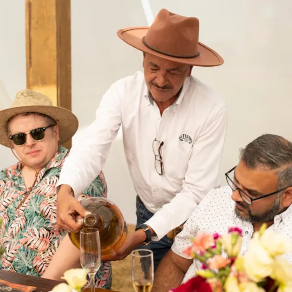 About Us Community Men Drinking El Tesoro